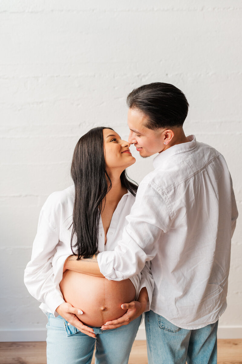 A neutral maternity session in studio with an expecting couple in Lewiston, Idaho