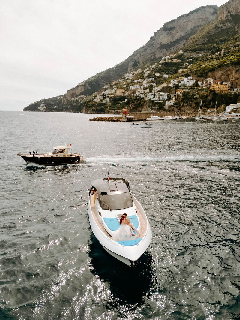 Sharlie Faye, Moncton Wedding and Boudoir photographer on a boat in amalfi coast in italy