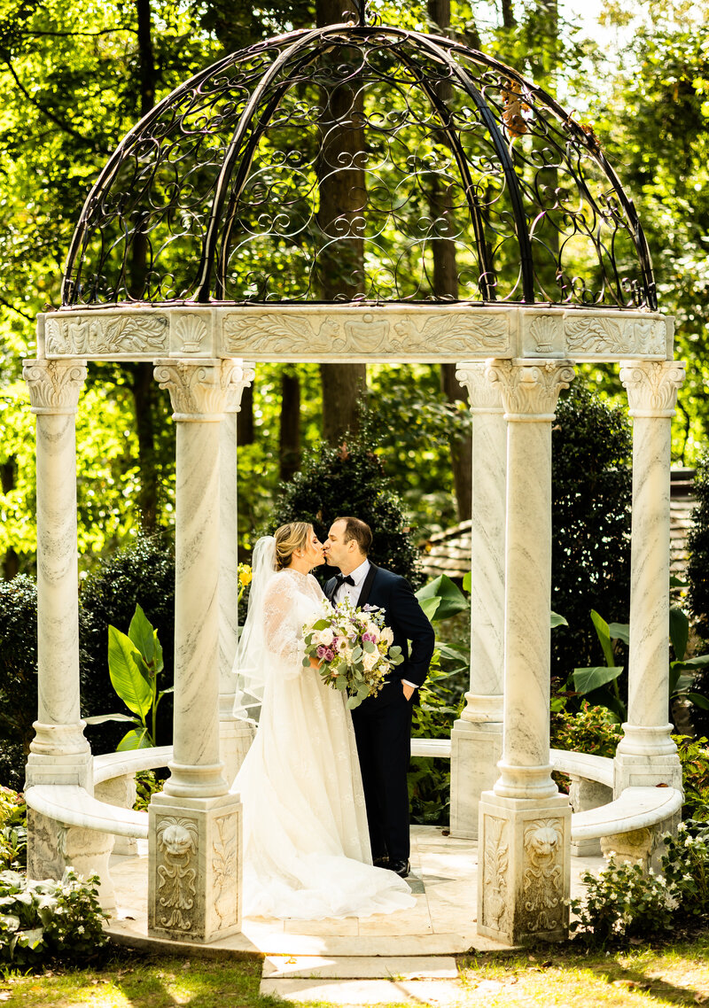 Bride and Groom kiss at Gramercy Mansion after a first look, Maryland Wedding