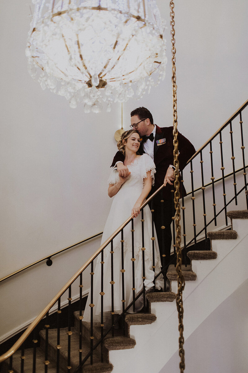 Couple poses on stairs in Washington DC Wedding