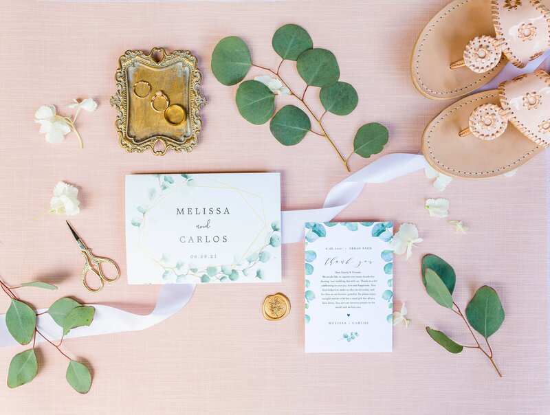 flat lay details with pink, gold and greenery