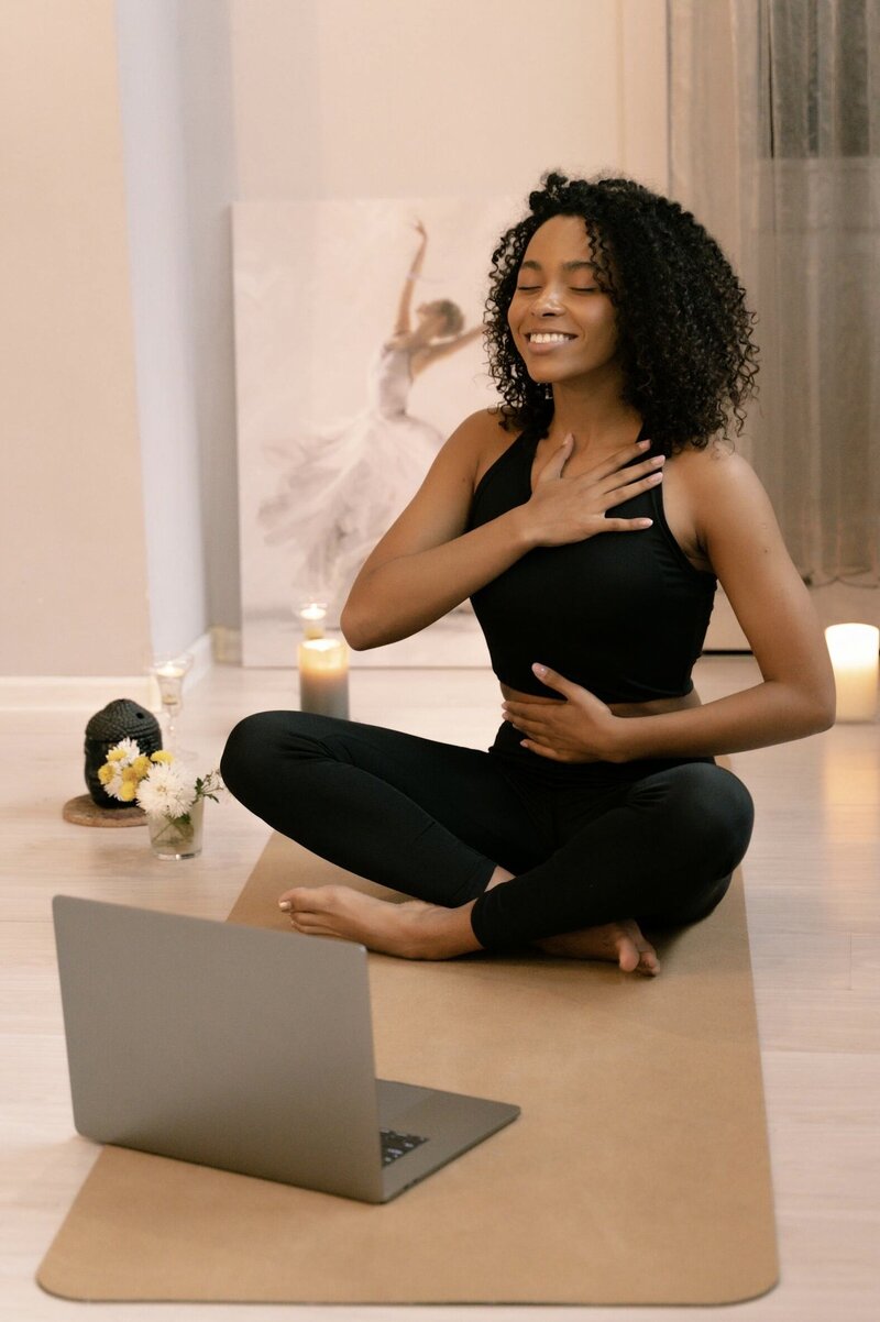 african american woman attending a KAP session virtually with Supported Awakening