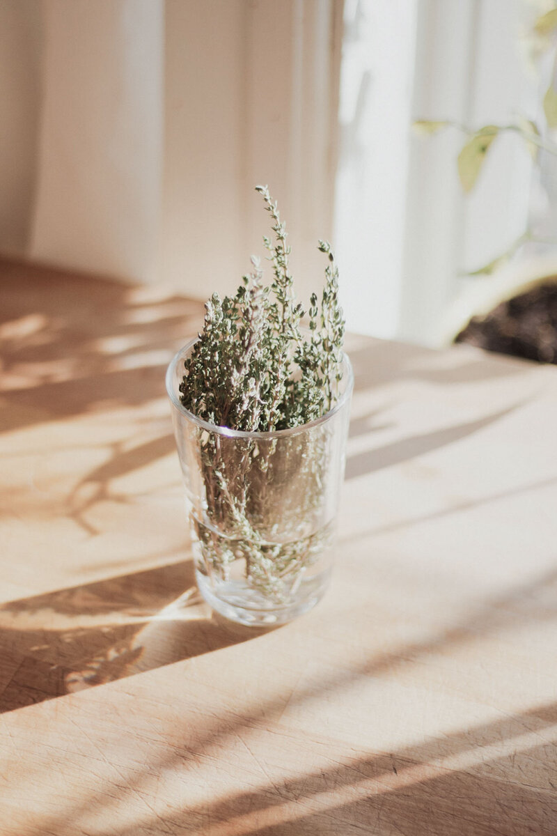 bundle of thyme in a glass jar