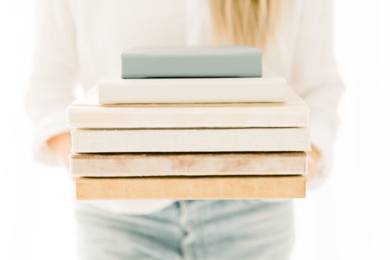 Stack of photo albums in Orange County Luxury Photographer