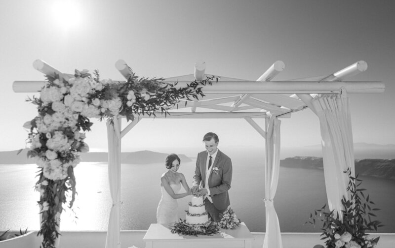 modern Minimalist for intimate wedding in santorini Greece cake cutting