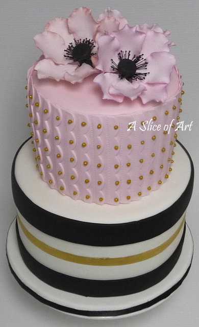 pink anemone cake with gold and black stripes