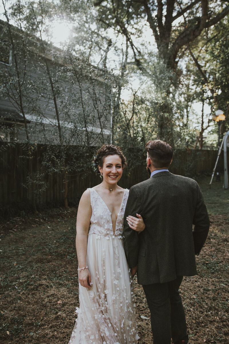 bride and groom outside in backyard