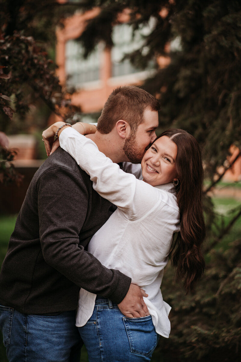 Couple smiling at engagement session in syracuse new york
