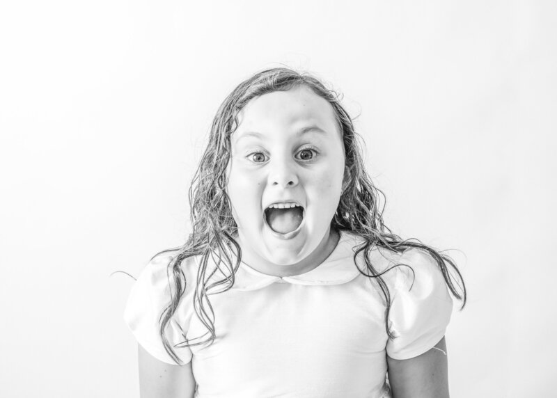 Little girl photographed in soft natural light at a modern Deltona photo studio.