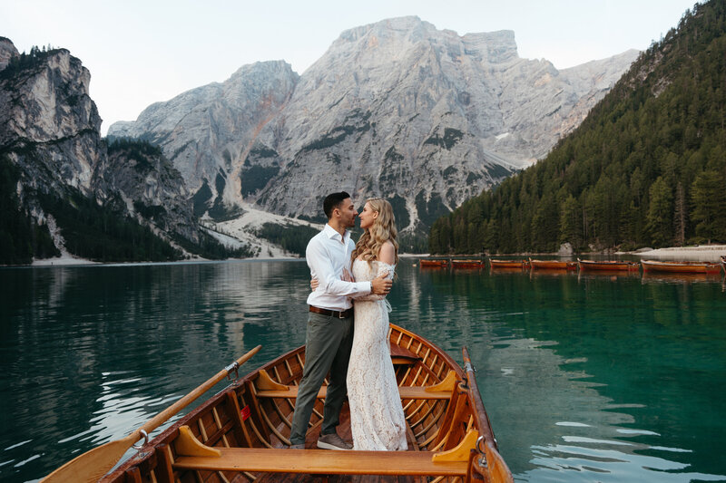 Couple eloping on a boat at Lago di Braies AKA Prager Wildsee, from the La Palafitta Boathouse
