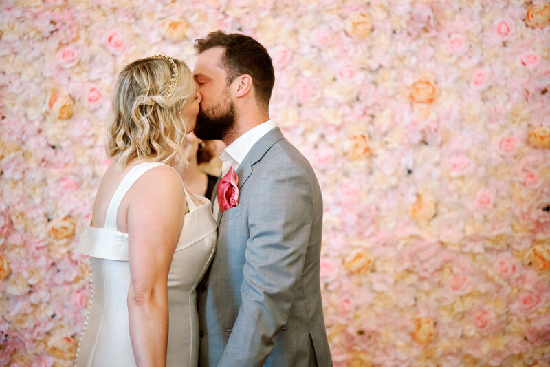 Bride and groom share their first kiss