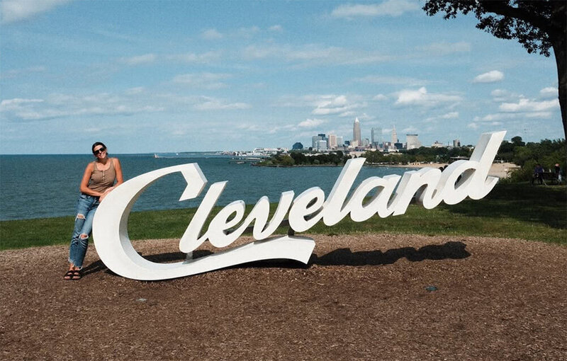A travel blogger shares insights about exploring Cleveland, Ohio, showcasing local attractions and experiences.