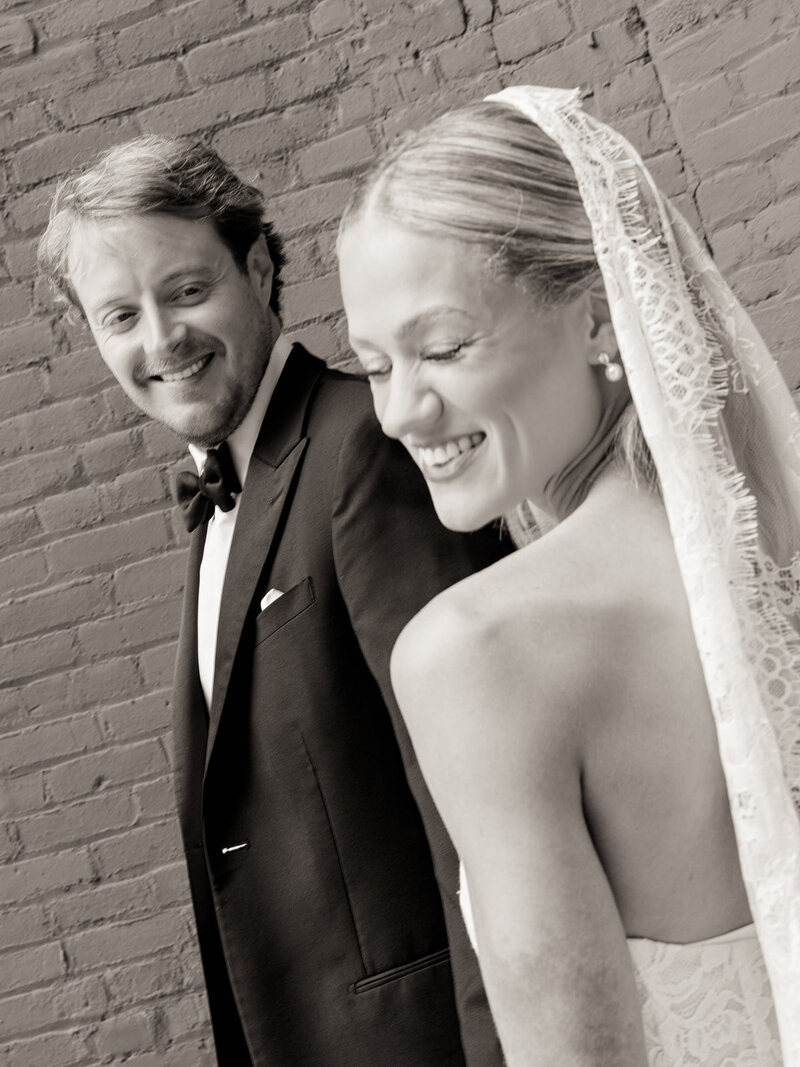 Aubri and Cody laughing together in black and white