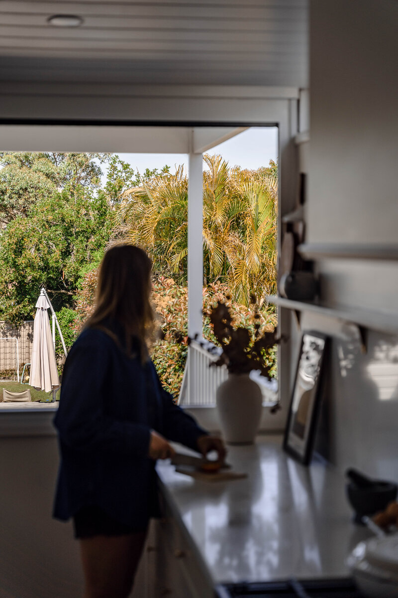 jesse-mccabe-renovation-kitchen-woman-chopping-mayfield-nsw