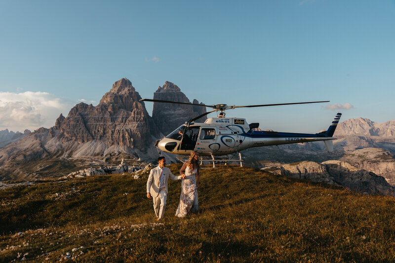 Couple Eloping at Cadini di Misurina by Helicopter with Tre Cime in the background