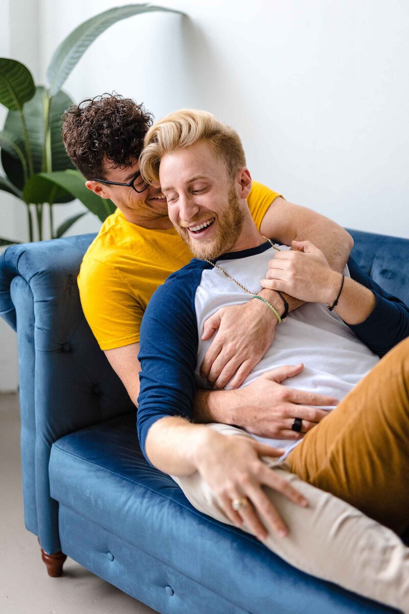 Gay couple on blue couch