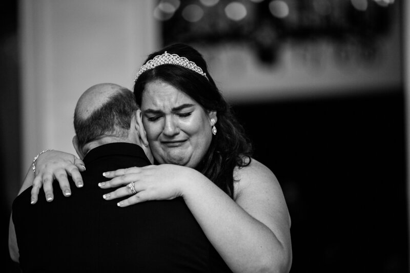 Bride at Disney wedding dancing and crying with Father