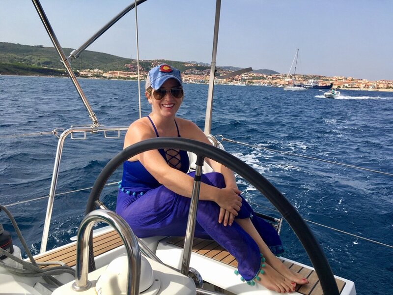 a woman on a sailboat in Sardinia