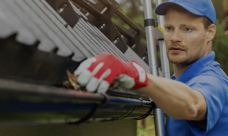 Gutter and exterior paint service on multi-story residence