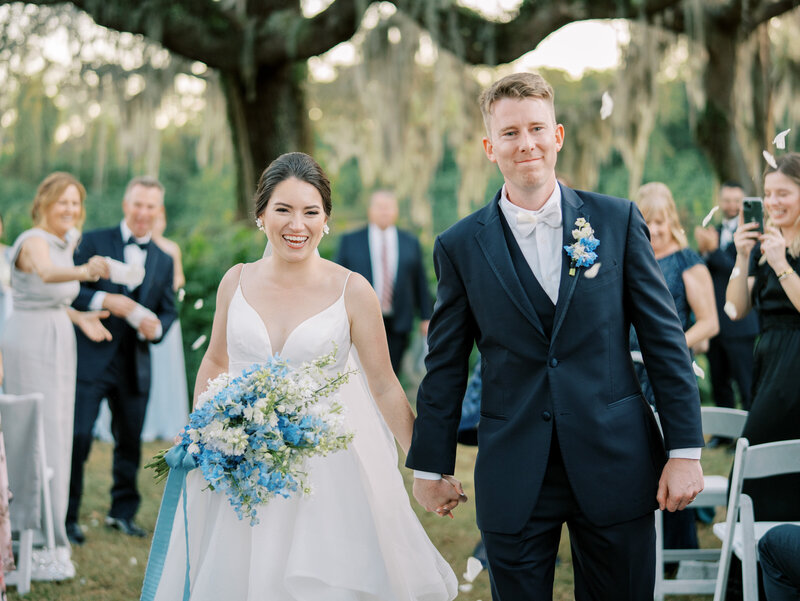 innisbrook resort wedding bride and groom exit wedding ceremony smiling in Tampa Bay