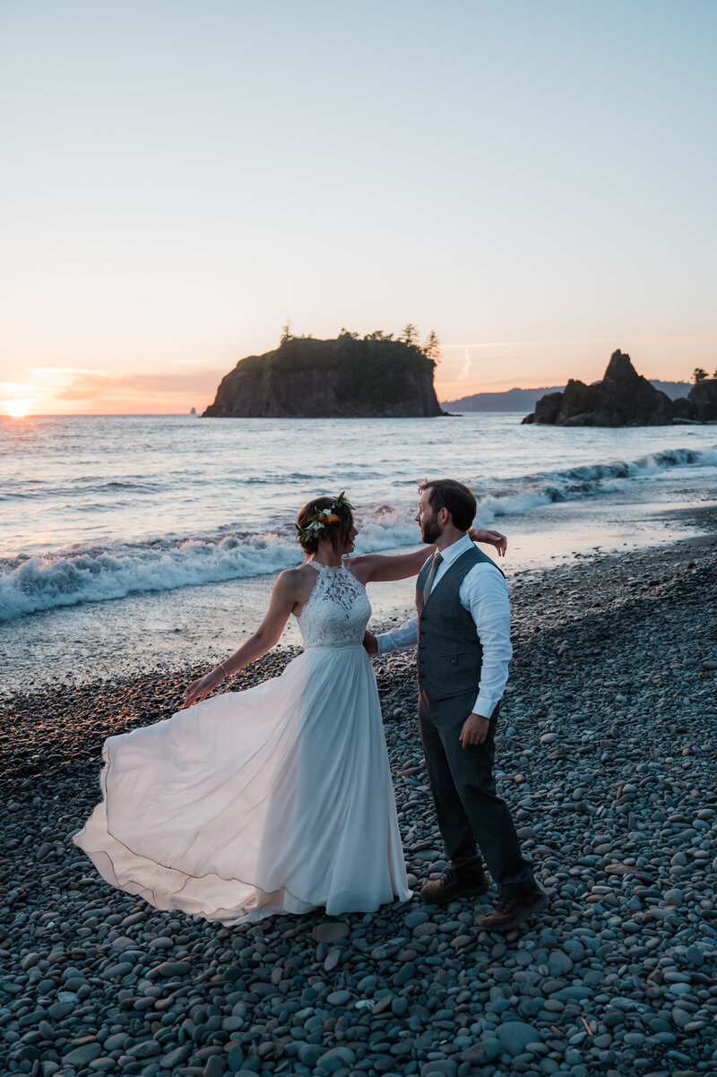 Couple having their first dance at Ruby Beach during their elopement day in Olympic National Park