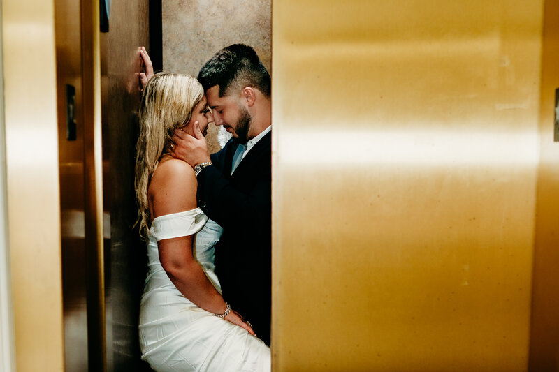 romantic elopement pose in coffee shop in downtown Lafayette, Louisiana