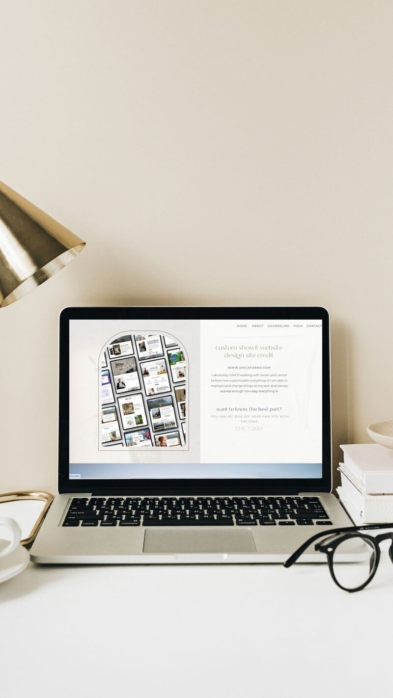 A laptop, lamp, and coffee cup arranged on a desk, featured on the website's credit page.
