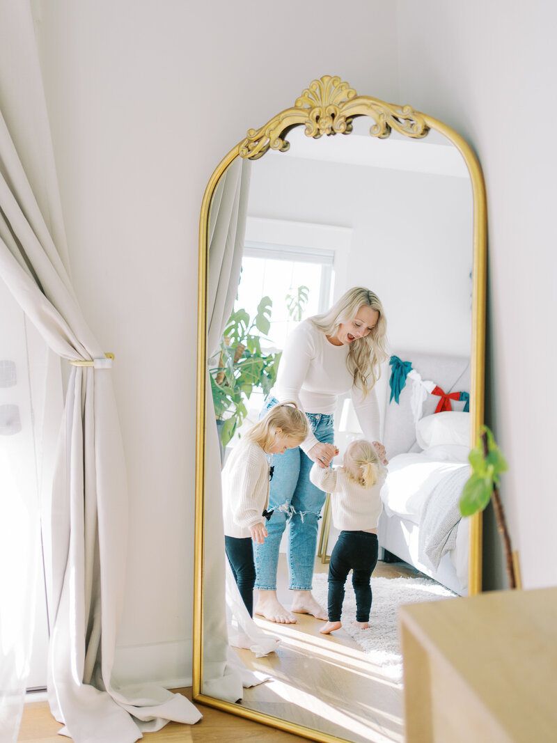 a mom dancing with her two small kids