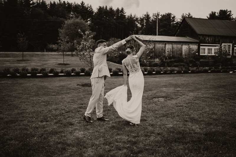 bride and groom running in a field