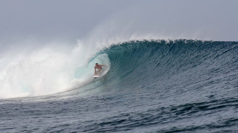 Kai Haugland, founder of Laelae Development, surfing North Shore Kauai