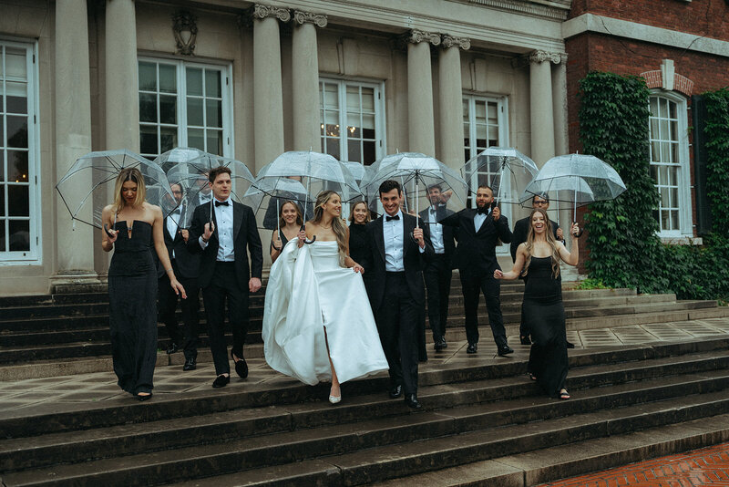 couple walking with wedding party on their wedding day, captured by Elsie Goodman, an NYC wedding, engagement and couples photographer
