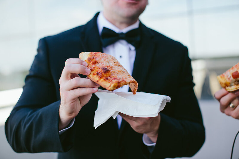 Alternative-Wedding-Photographer-Groom-holding-pizza