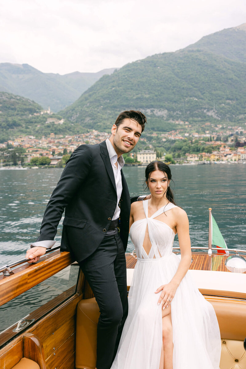 Candid image of a wedding ouple during their boat photo shoot during their wedding day at Villa Balbiano on Lake Como in Italy