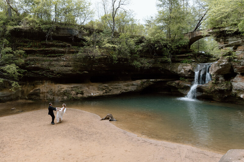 Couple toasting with donuts