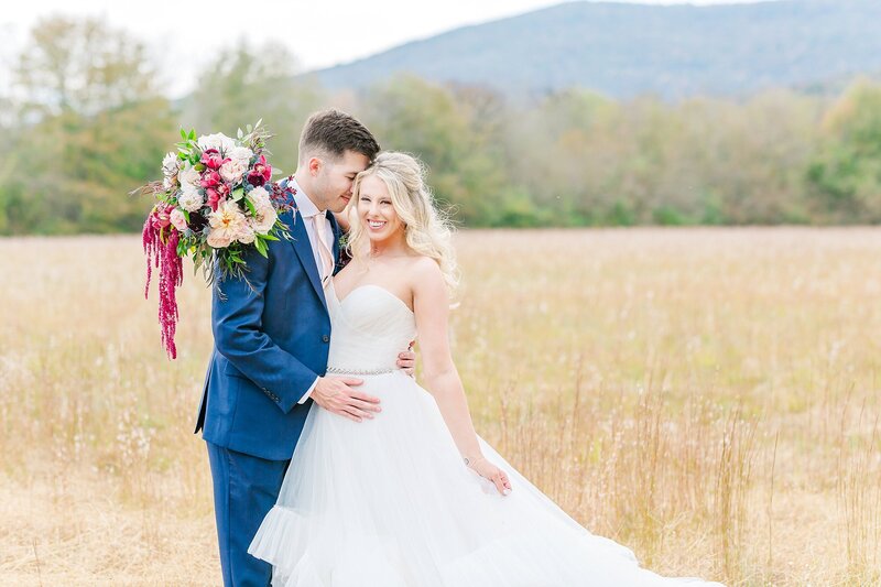 Bride and groom in field at fall wedding   | Alabama wedding photographer Amanda Horne