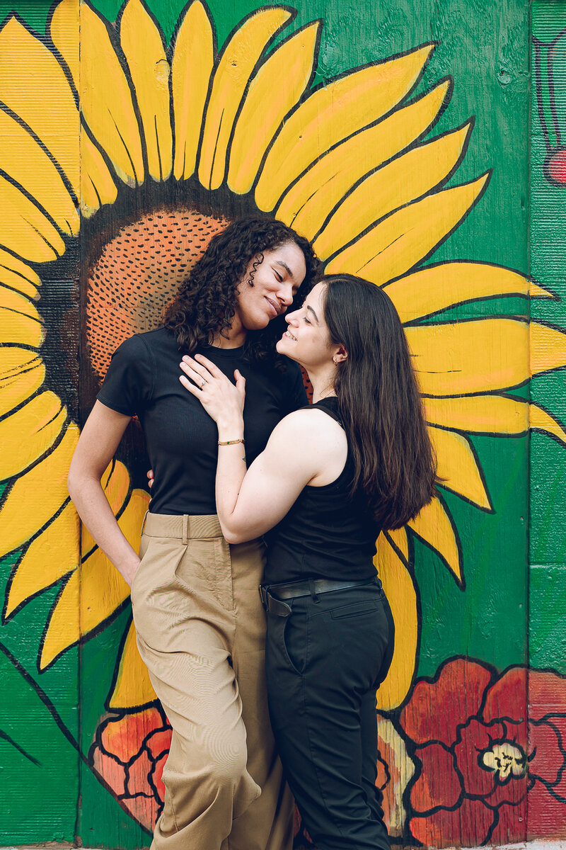 A couple poses in Ukrainian Village during their engagement session in Chicago