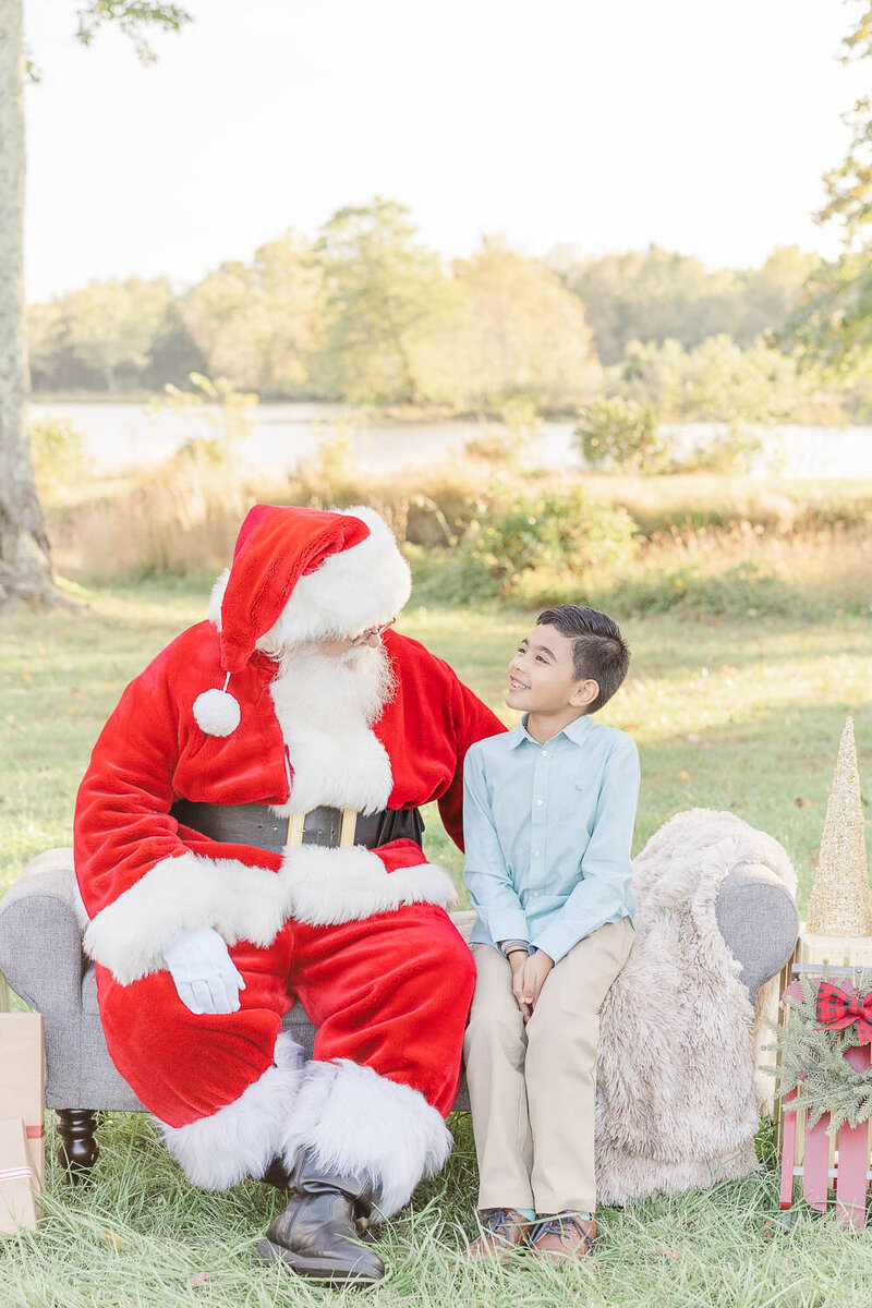 boy talking to Santa taken by Northern Virginia Christmas mini session photographer