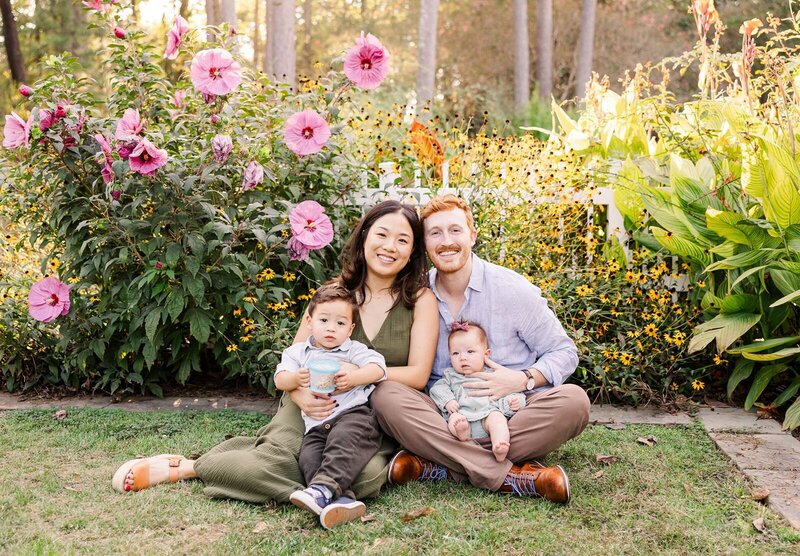 parents and two young children pose for outdoor family portrait in Birmingham, Alabama