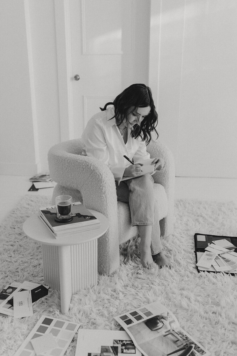 couple holding each other close in front of river