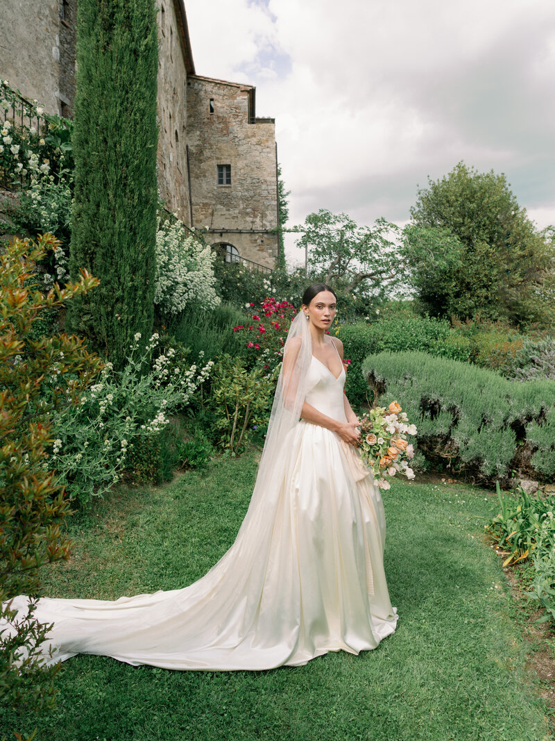 Bride in Danielle Frankel Studio gown at her wedding in Tuscany at Monteverdi