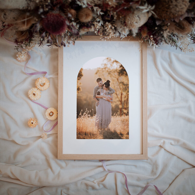 Oak framed family photo with arched mat