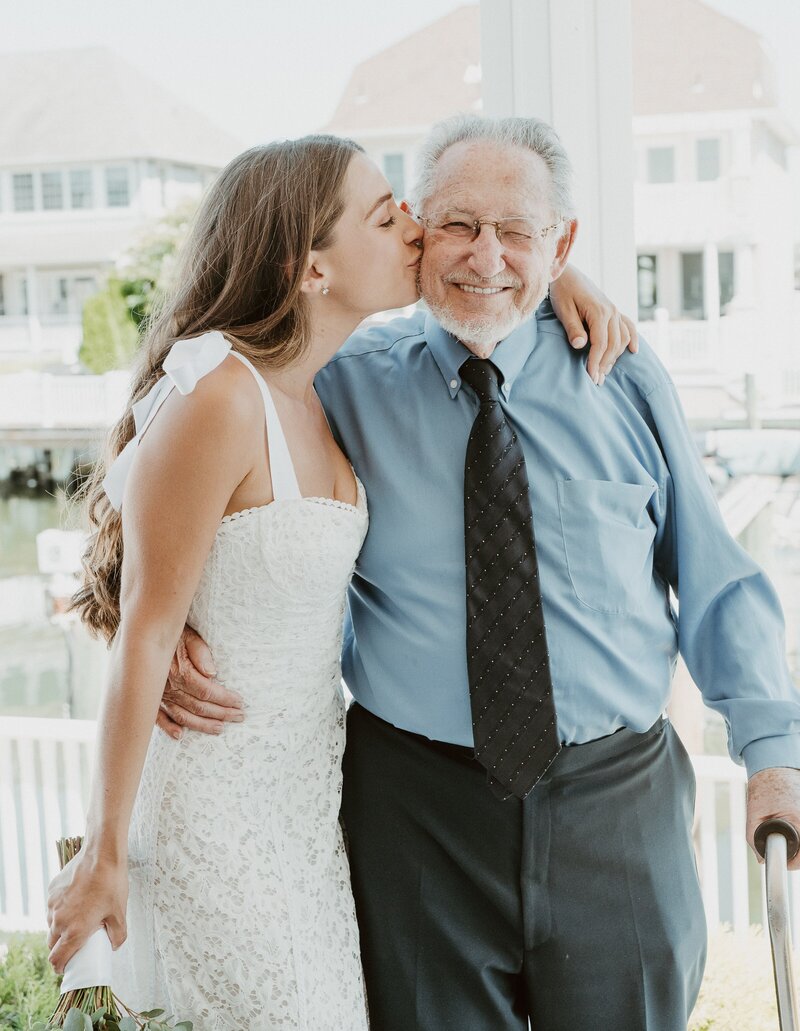 Bride kissing grandfather at Palm Springs wedding