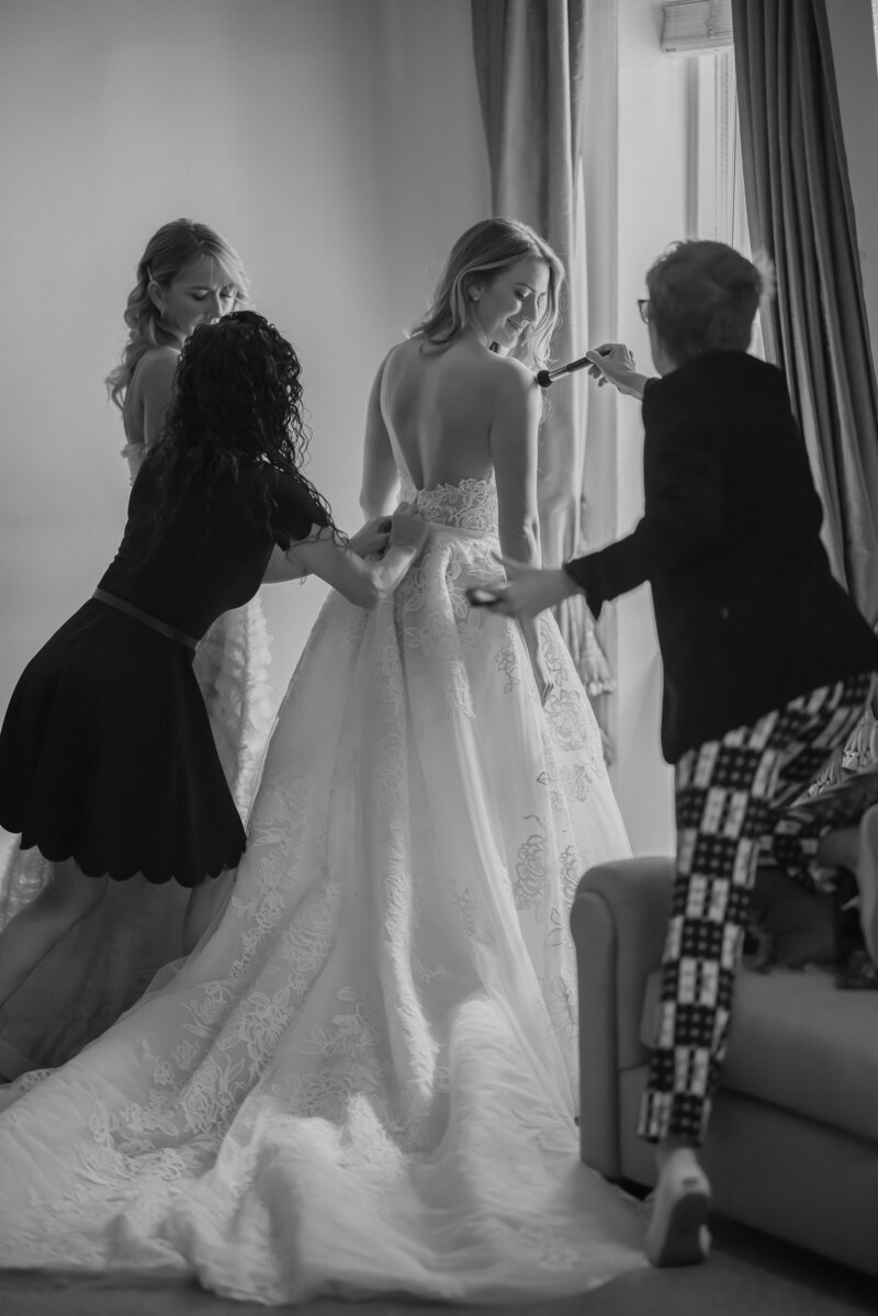 Elegant photo of the bride getting ready in a luxurious suite before her Union League Philadelphia wedding, capturing a timeless and emotional pre-ceremony moment.