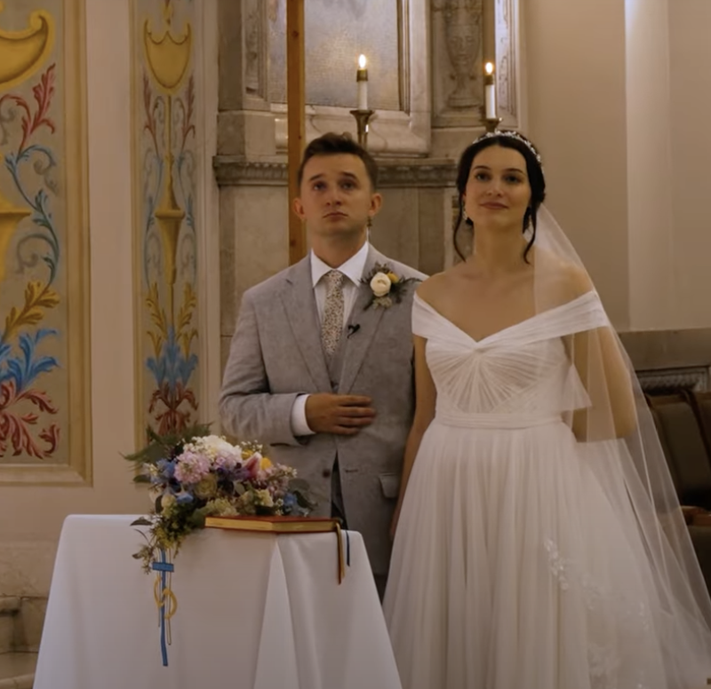 a bride and groom during a Catholic wedding ceremony