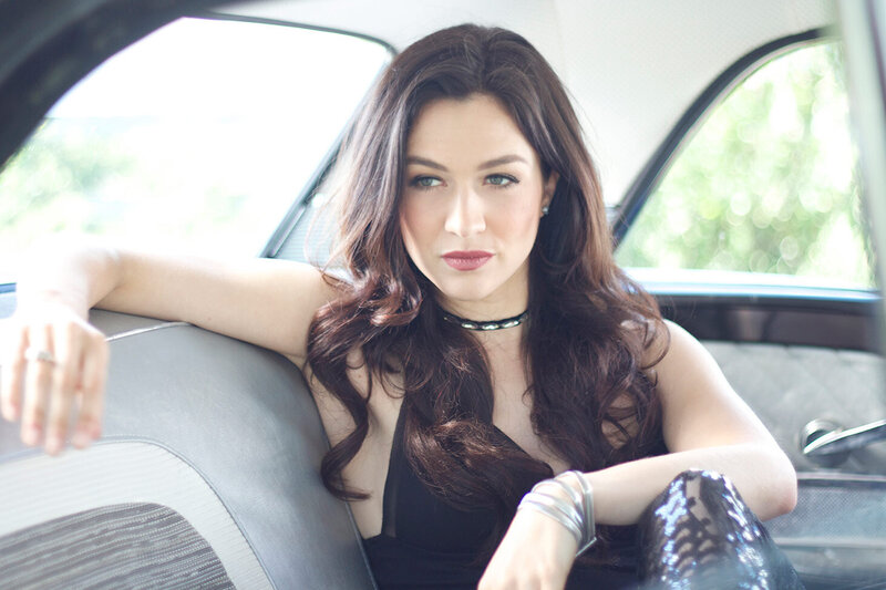 Female Country Musician Portrait Kristin Carter sitting in backseat of vintage car