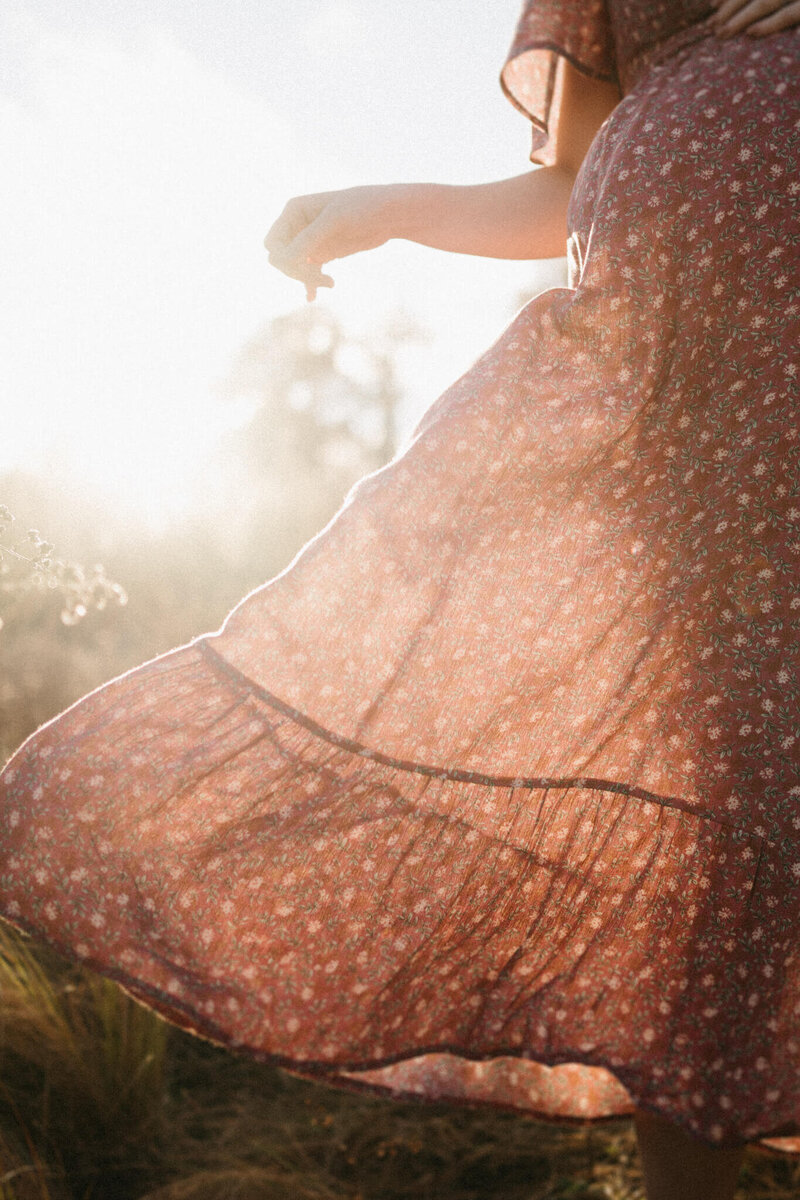 glowing sun bouncing off maternity dress