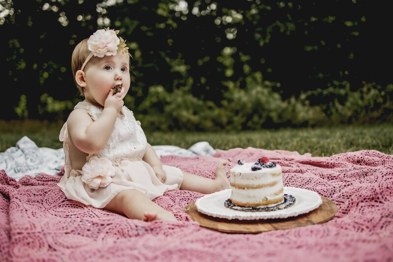 baby eats her smash cake