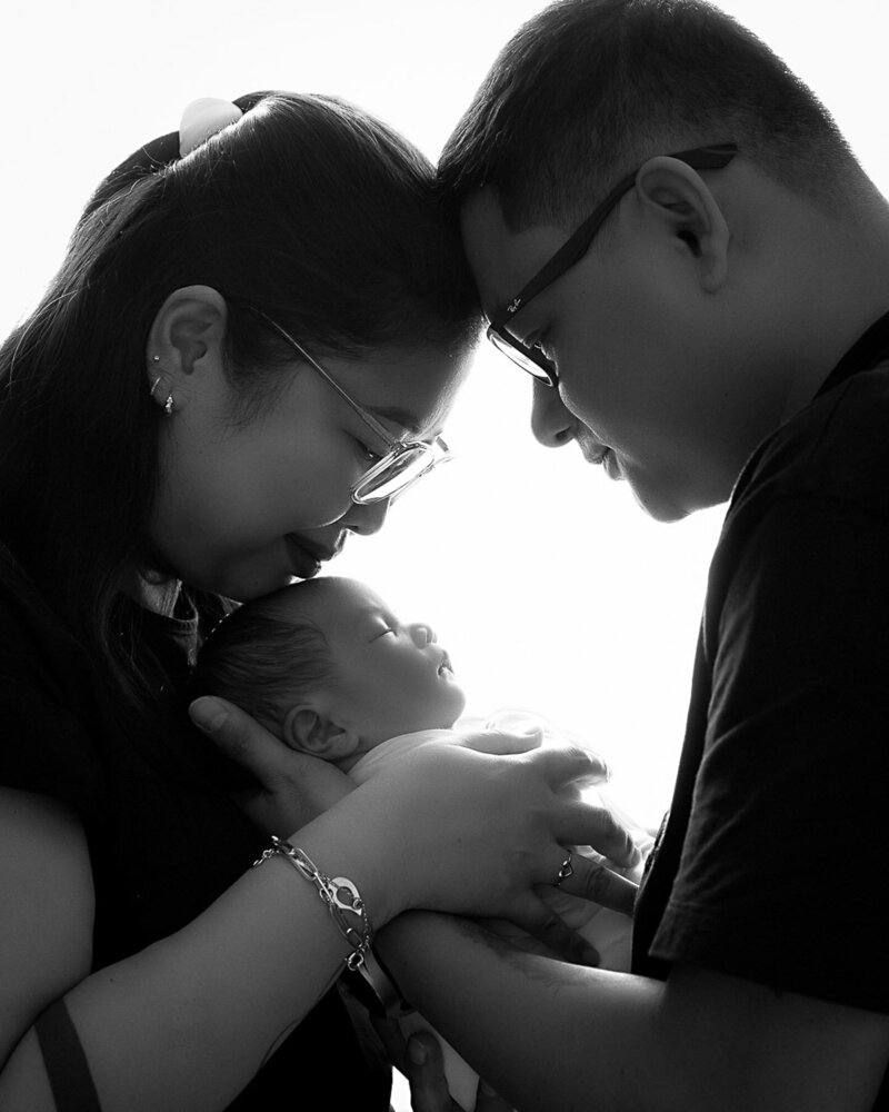 family photoshoot with newborn, black and white theme