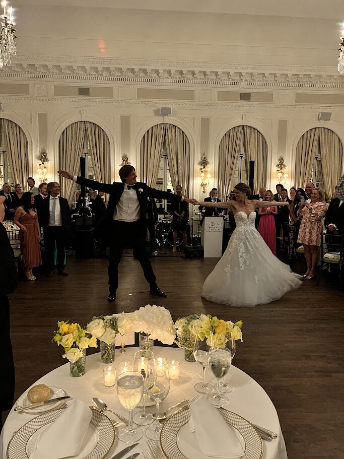 Bride and groom dancing together on dance floor
