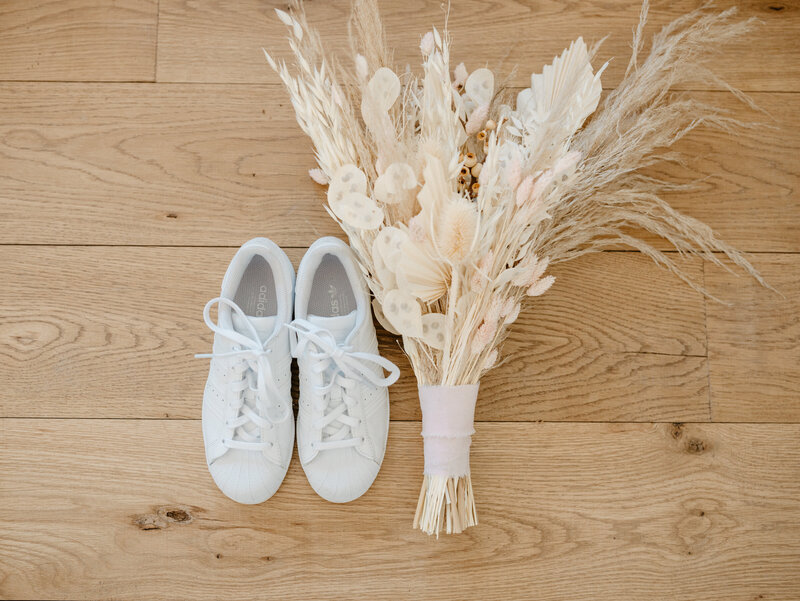 brides adidas sneakers and bouquet at wedding in Palm Springs